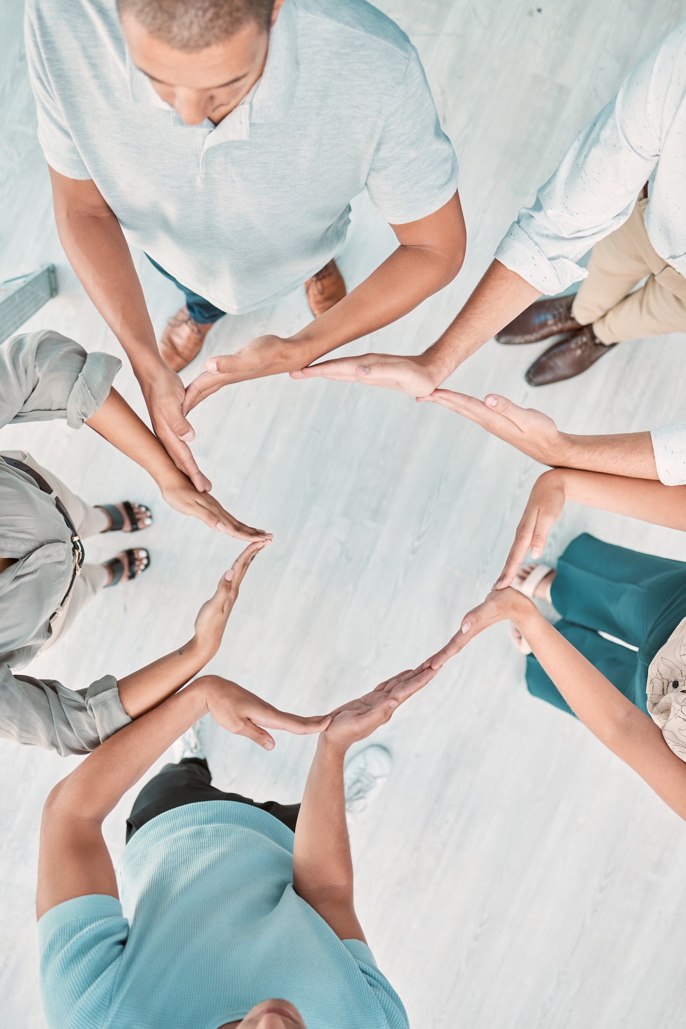 Support, group and heart hand with top view for company solidarity, synergy or team building. Trust